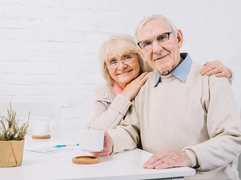 Retired couple relaxing together at home